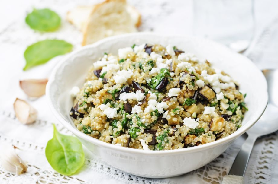 quinoa spinach eggplant feta salad on a white background. the toning. selective focus
