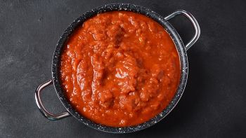 Matbucha - Moroccan Tomato dip, spread or condiment - Cooked Spicy Tomatoes, Peppers, Garlic and Chili Pepper