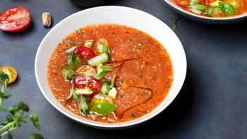Spanish fresh cold tomato soup gazpacho with Basil