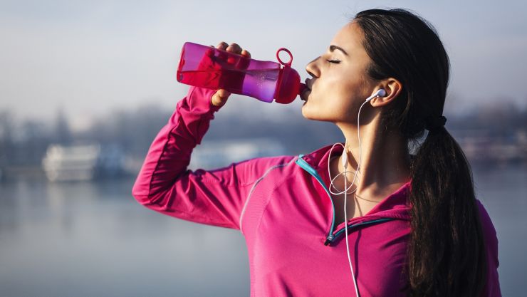 Fitness woman drinking water ; Shutterstock ID 525308707