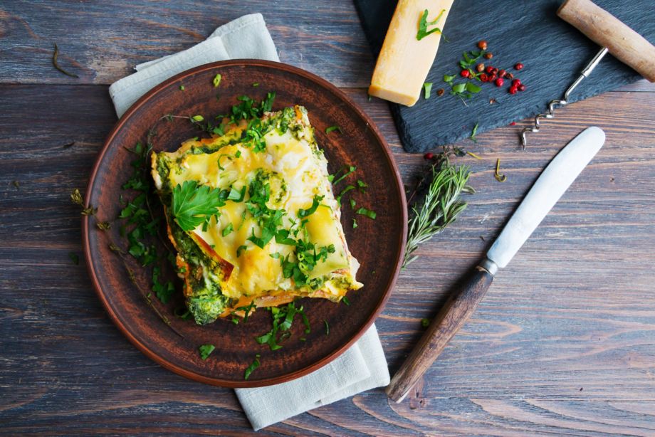 Vegetable lasagne served on ceramic plate - italian cuisine - vegetarian diet. Closeup.